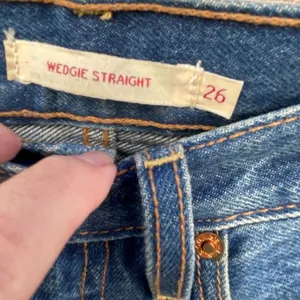 Levi’s 26” Wedgie Straight high waisted button fly raw hem jeans. thumbnail 6