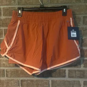 Stylish Women's Athletic Shorts in Rust by Nike thumbnail 1