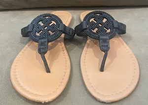 Daisy Fuentes Black and Tan Sandals with Classic Slip-On Design thumbnail 1