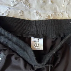 S BLACK CARGO JOGGERS WITH buckles and design thumbnail 5