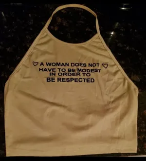 “A Woman Doesn’t Have To Be” Quote Halter Crop Top thumbnail 2