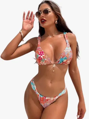 &merci Vibrant floral bikini set perfect for summer. Features a mix of red, pink, and blue hues for a standout look at the beach or pool. thumbnail 1