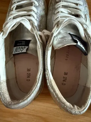 GOLDEN GOOSE Super-Star Iridescent and Glitter Leather Sneakers - Sz 38 - US 7 1/2 These are in good condition with light wear throughout. They are a pretty hard to find but super cute style. They have like holographic leather and glitter areas. Please see pics for details. Metallic leather upper Round toe Lace-up closure White leather star Cushioned insole; unlined Rubber sole Made in Italy thumbnail 15