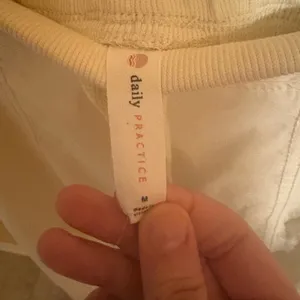 Daily Practice Anthropologie light yellow wide leg track pant sweatpants thumbnail 2