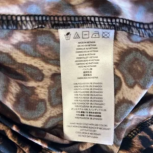 Michael Kors stretchy leopard pullover top w gold logo clasp NWOT thumbnail 10