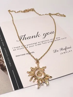 Gold Sun swirl charm necklace thumbnail 1