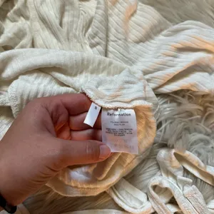 REFORMATION Rosebud Ribbed Wrap Top In Ivory thumbnail 6