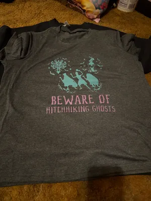 Gray t-shirt featuring a ghost print in teal and pink of the Hitchhiking Ghosts of the Haunted Mansion. Great for Disney parks and Halloween parties. thumbnail 1