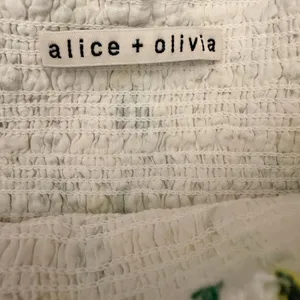 Alice + Olivia Bethie Mini Skirt in "Drifting By Floral" Smocked Tiered- Small thumbnail 5