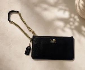 COACH | Madison wristlet black and gold thumbnail 1