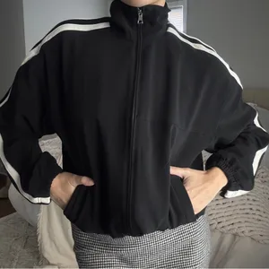 Athleta black and cream cinchable adjustable zip up track jacket thumbnail 1