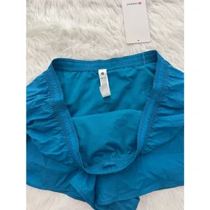 Lululemon Dolphin Hem Mid Rise Running Shorts 3" Hawaiian Blue Size XL thumbnail 9