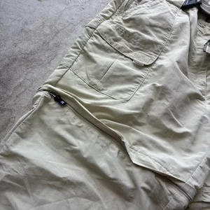 L.L. Bean convertible cargo hiking pants feature a built-in webbed belt and zip-off lower legs. thumbnail 2