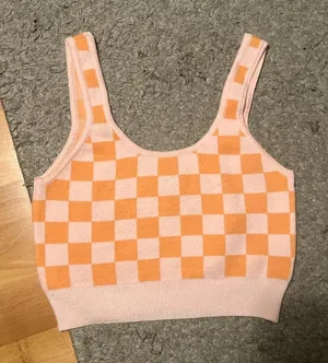 Orange and pink checkered crop top peach colored #croptop VERY soft and comfy but not my taste anymore Bought at Pacsun No flaws and perfect condition thumbnail 1