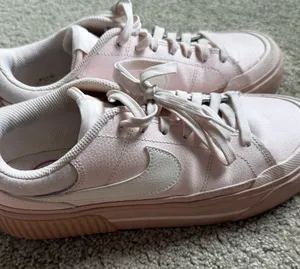 Nike Women’s Light Pink Low-Top Sneakers with White Swoosh thumbnail 1