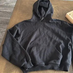 SKIMS COTTON FLEECE HOODIE, Black, Large, $80 thumbnail 6