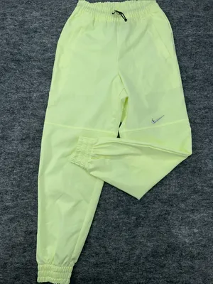 Nike Women's Sportswear Woven Pants in a bright neon green/yellow XS thumbnail 4
