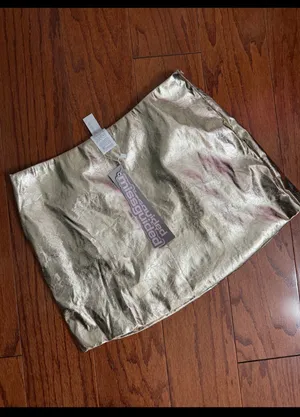 Missguided Gold faux leather skirt - size Smal NWT ***Refer to measurements. Beautiful skirt to wear out on a party trip. Fun & spunky. Measurements approximately 15” waste x 14” long. Non- smoking home. priced to sell at as is condition. Don’t like my price, make reasonable offer! And thank you for checking my closet. thumbnail 2