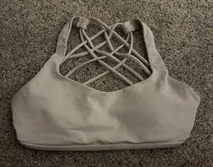 white lulu sports bra! barely worn, great condition! size 0! comes with pads! originally $48, selling for $25! ! thumbnail 1