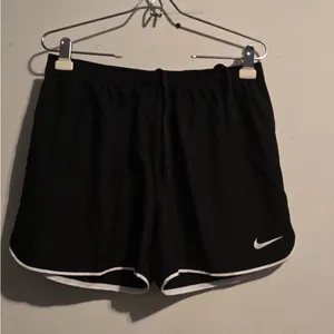 Nike Women's Black Athletic Mesh Shorts with White Trim thumbnail 6
