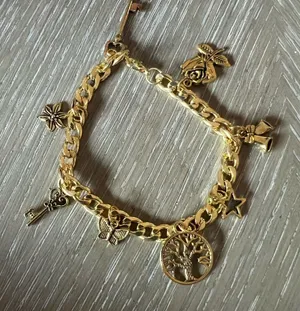 Gold Charm Bracelet with Intricate Details thumbnail 1