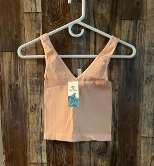 NIKIBIKI Women Seamless Plunge V-Neck Ribbed Crop Top, Made in U.S.A, One Size Elevate your style with this chic peach ribbed V-neck top. Perfect for any occasion. thumbnail 1