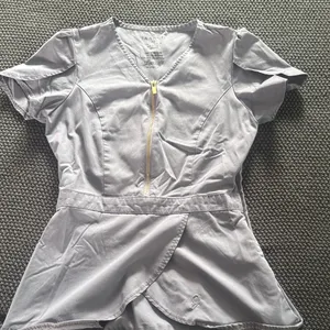Jaanuu Peplum scrub top thumbnail 1