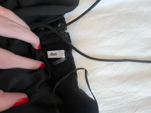 These Three Boutique Black Bow Halter Romper thumbnail 2