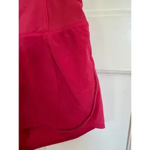 Lululemon bright pink running shorts Size 4 thumbnail 4