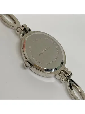 Silver tone women’s quartz analog watch 19mm oval white dial rhinestones running thumbnail 6