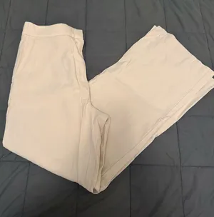 Tan high-waisted trousers with a relaxed fit. Size: 10 #highwaisted #trousers thumbnail 1