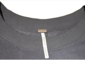 Free People She's Just Cute pullover sweatshirt in Washed Black. Size XS. Crew neck with floral fabric ruffle detail. Pre-owned with on spot of peeling shown in last photo thumbnail 3