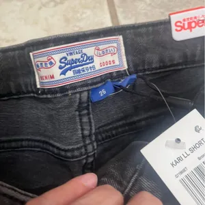 NWT Superdry Cut Off Denim Jean Kari‎ Longline Shorts 26 Coastline Black shorts thumbnail 10