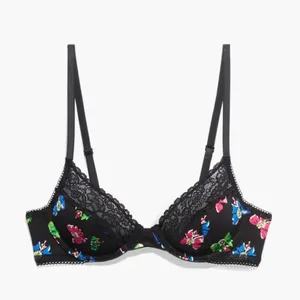 Savage X Fenty Cotton Essentials Unlined Bra Lace Bad Butterfly Black Size M Breathable Fabric: Soft and stretchy signature cotton-jersey body construction for comfortable, all-day lounge or streetwear wear.Unlined Support: Features lightweight, unlined 3-layer underwire cups and supportive wings designed to hug and lift your natural shape without extra bulk.Signature Details: Finished with delicate, tonal scalloped logo lace trim running along the cups.Custom Fit: Features fully adjustable shoulder straps and a classic hook-and-eye back closure with tonal nylon-coated hardware.Materials: Body is 95% Cotton, 5% Elastane; Delicate Lace trim is 82% Polyamide, 18% Elastane.Care Instructions: Hand wash cold, lay flat to dry. thumbnail 2