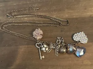 Gold tone love theme charm tassel necklace thumbnail 3