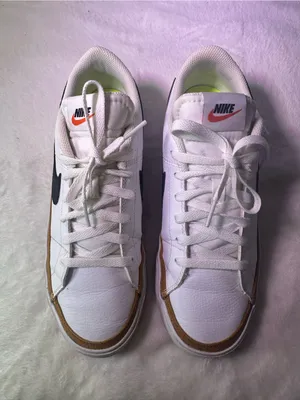 Nike White Sneakers with Black Swoosh and Orange Accent thumbnail 4