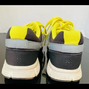 Nike women's Revolution Grey/Yellow Running Shoes. 9 thumbnail 5