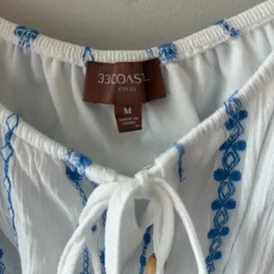 BUCKle- 33 Costal -Women's White Peasant Blouse with Blue Embroidery thumbnail 3