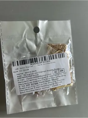 14K Gold Plated Multi-Layered Necklace with Star, Key, and Butterfly Charms thumbnail 3