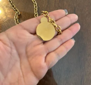 Gold tone coin pendant necklace with a round charm and chain thumbnail 2