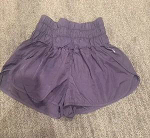 Free People Smocked Waist Athletic Shorts in Purple thumbnail 1