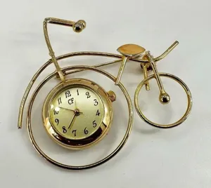 CF Gold tone watch bicycle brooch thumbnail 1
