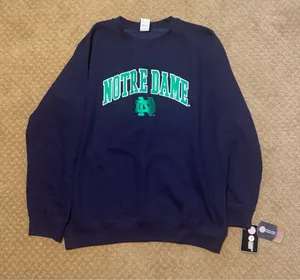 Genuine Merchandise Navy Notre Dame crewneck sweatshirt with green arched text and logo, size L #collegiate #university #nortedame thumbnail 1