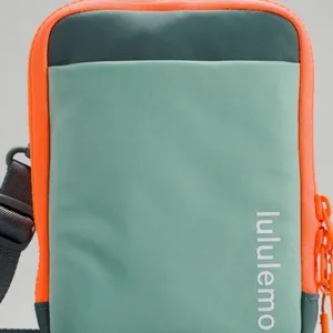 Lululemon easy access crossbody orange green bag travel casual bag thumbnail 1