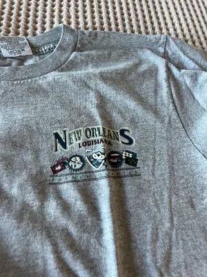 Gildan Classic gray short-sleeve tee featuring a small New Orleans Louisiana graphic on the chest. Comfortable cotton blend with a relaxed fit. Versatile gray color pairs well with casual outfits. Ideal for everyday wear and travel. thumbnail 4
