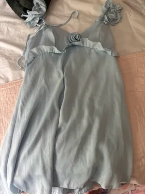Light blue dress with ruffled sleeves and rose on the front thumbnail 1