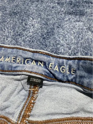 American Eagle Light Wash Distressed Denim Shorts Size 4 thumbnail 5