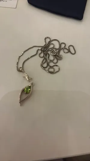 Silver necklace and earrings set with green gemstones thumbnail 2