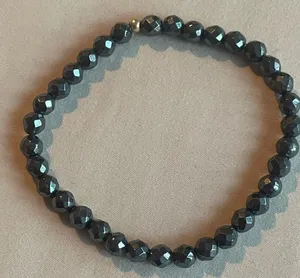 Black Beaded Bracelet with gold bead thumbnail 1