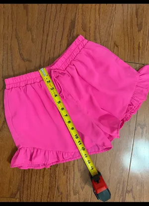 Hot Pink flowy ruffle-hem shorts with elastic drawstring & lightweight - Size M. relaxed design. Gently warn and excellent condition. Measurements approximately 12” waste, not fully stretched out x 12” long. Non-smoking home. priced to sell at as is condition. Don’t like my price, make reasonable offer! And thank you for checking my closet. thumbnail 6